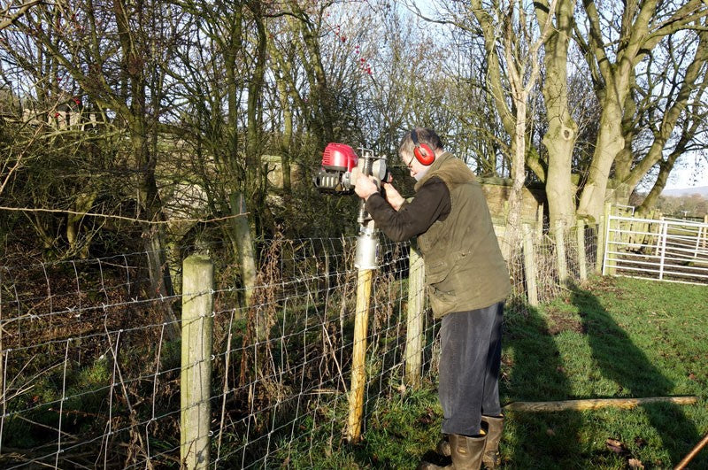 Installing wooden fence post with The Easy Petrol Post Driver
