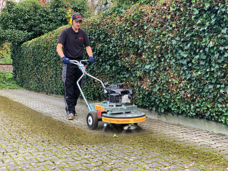 WKB660 removing weeds from block paving