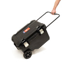 A black protective Tough Box, with wheels and a drag handle, with an Easy Petrol Post Driver inside