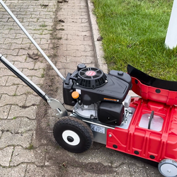 Westermann WKB330 Weed Ripper machine being used to clean block paving