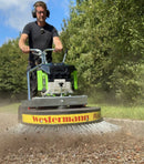 Person operating a Westermann machine to clear debris