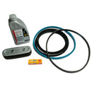 A studio image of a service kit, featuring a bottle of oil, a set of belts, an air filter and a spark plug