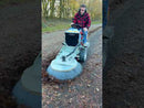 Video showing the Westermann CM2 PRO Ride-On with R1000 brush attachment, clearing thick leaves stuck to block paving.