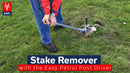 A person using a manual, levered stake remover to remove a Marquee Pin from the ground
