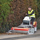 Man driving CM2 PRO with AX 1200 attachment 