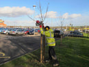 A person driving in a 4" round timber post with the Easy Petrol Post Driver