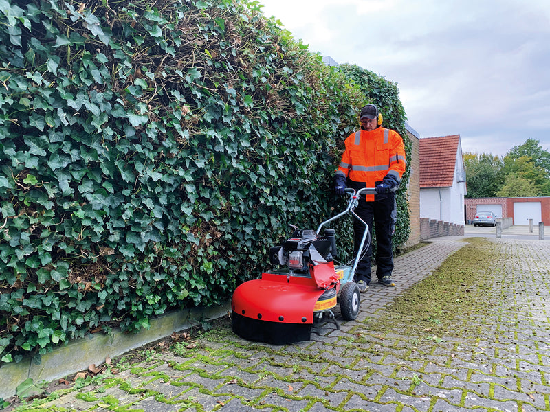 Moss removal with a wheeled machine